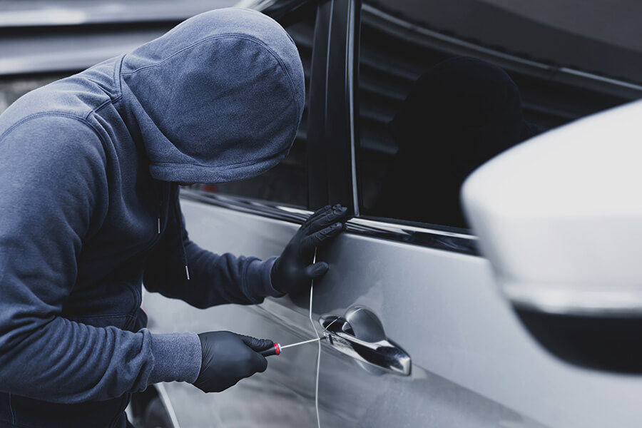 car thief breaking into car