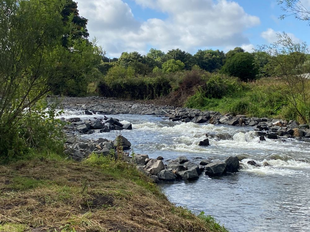 Rock ramp installed in the River Leven at Kirkland Dam, creating a natural-looking channel for fish passage and river habitat