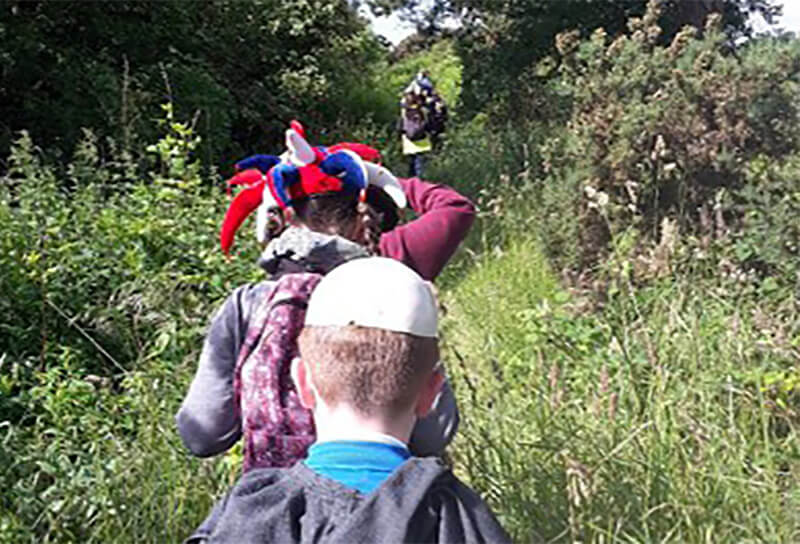 children walking through the countryside