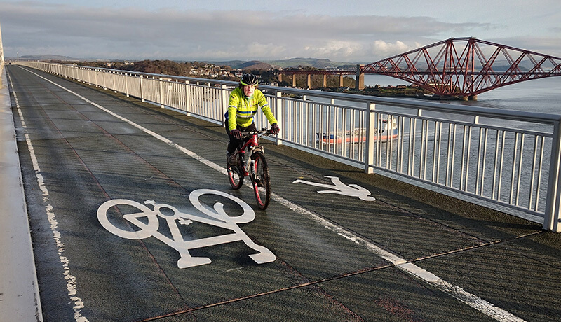 man cycling on a cycle path