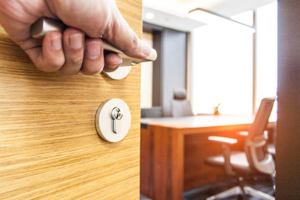 A hand opening a door