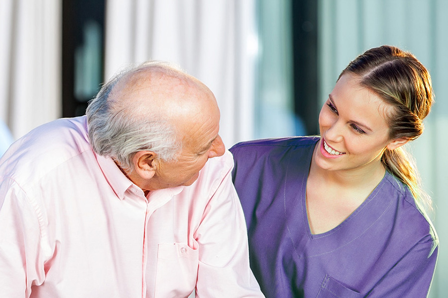 older man with care worker