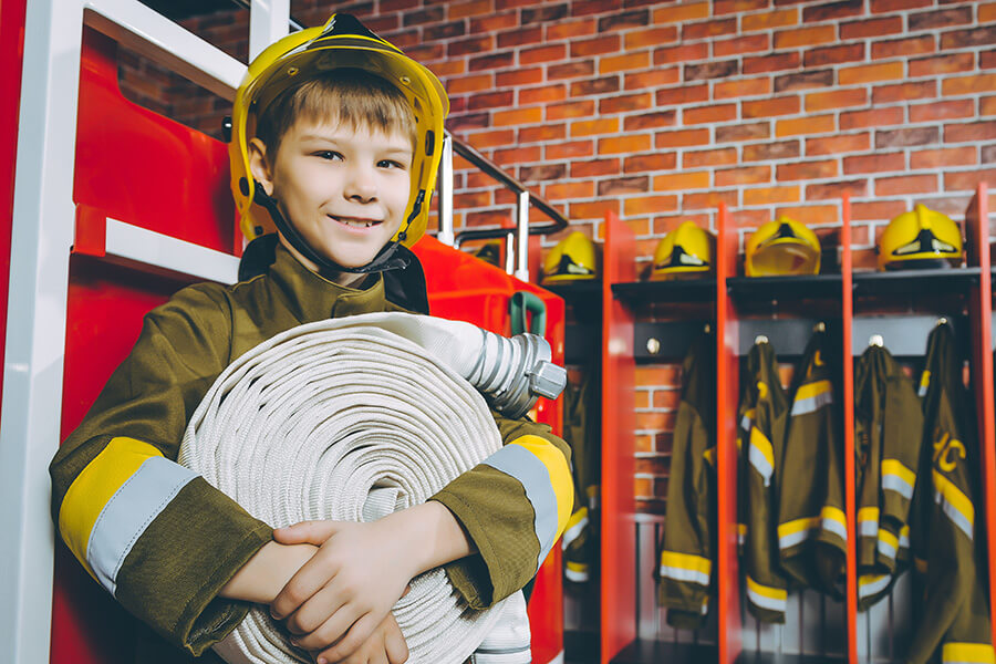 boy wearing Fire uniform 